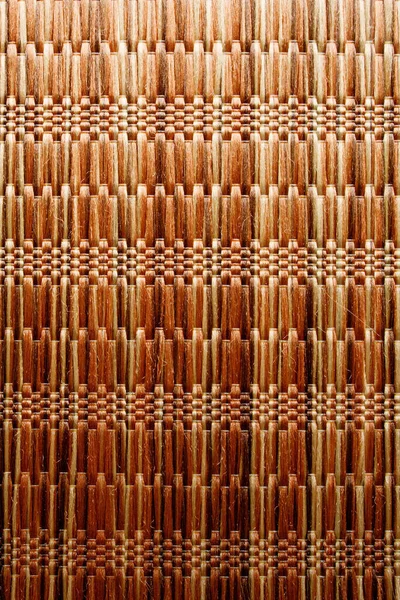 Wicker background made of natural straw. Full frame of densely woven straw pattern. Natural, natural background.
