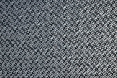 Jaluzi yapımında kullanılan eşkenar dörtgen desenli gri sentetik kumaşı kapat. Şablon tasarımı veya polyester malzeme soyut arkaplan