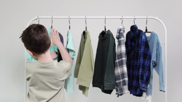 Boy Preschooler Standing Hangers Racks Clothes Chooses Clothes Today — Stock Video