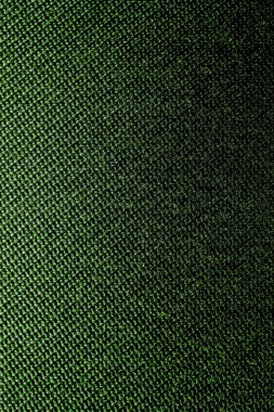 Hasır desenli tekstil malzemesinin koyu yeşil arka planı, yakın çekim. Zeytin dokusunun yapısı. Kumaş arkaplanı.