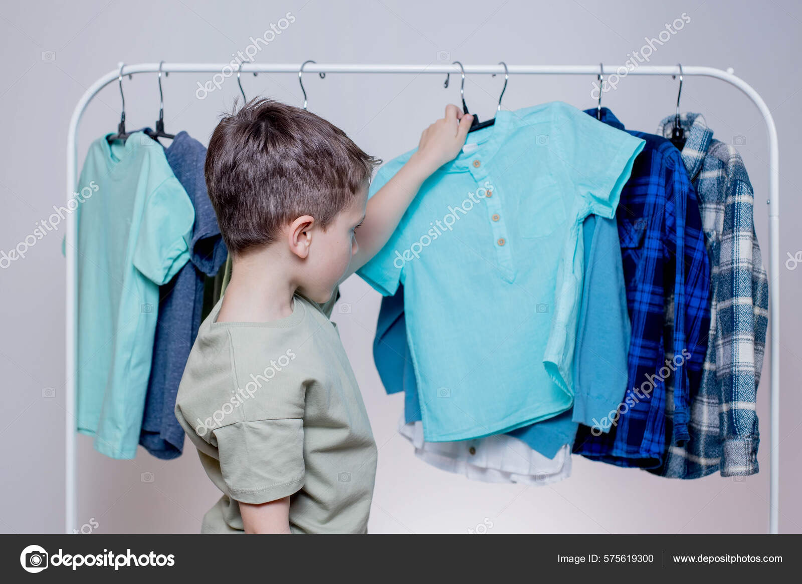 Boy Preschooler Standing Hangers Racks Clothes Chooses Clothes Today Stock  Photo by ©volody100@ukr.net 575619300