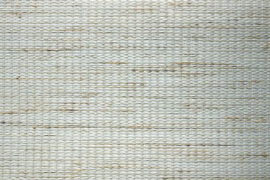 Yoğun desenli kumaşın bej arka planı. Kumaş jaluzi, paspas, duvar kağıdı üretimi için kumaş.