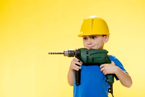 Smiling Boy Builder Blue Shirt Holding Drill — Fotografia de Stock