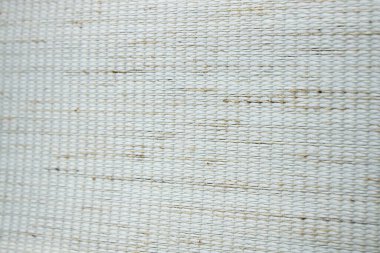 Yoğun desenli kumaşın bej arka planı. Kumaş jaluzi, paspas, duvar kağıdı üretimi için kumaş.