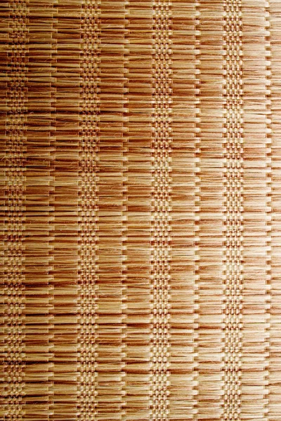 Wicker background made of natural straw. Full frame of densely woven straw pattern. Natural, natural background.