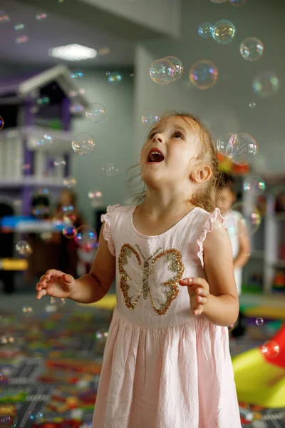 Little Girl Playing Soap Bubbles Dancing Being Good Mood Playroom — Stockfoto