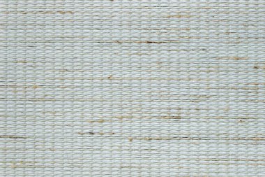 Yoğun desenli kumaşın bej arka planı. Kumaş jaluzi, paspas, duvar kağıdı üretimi için kumaş.