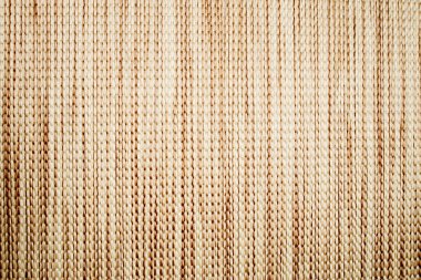 Textile pastel background with abstract weaving of threads. Fabric tufted multi-colored background.