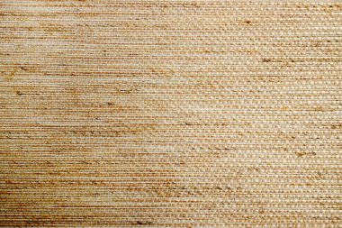 Textile pastel background with abstract weaving of threads. Fabric tufted multi-colored background.