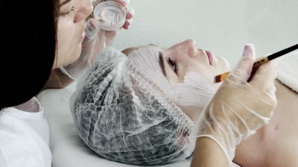 Beautician Applies Mask Skin Woman Face Therapeutic Purposes Rejuvenation Acne — стоковое видео