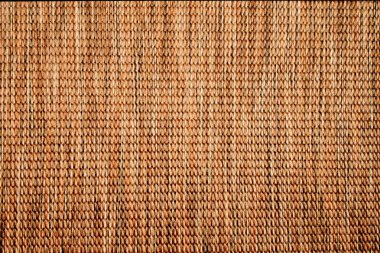 Textile pastel background with abstract weaving of threads. Fabric tufted multi-colored background.