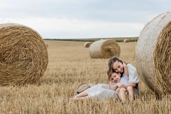 Young Mother Her Son Hugging Straw Bales Field Happy Family —  Fotos de Stock
