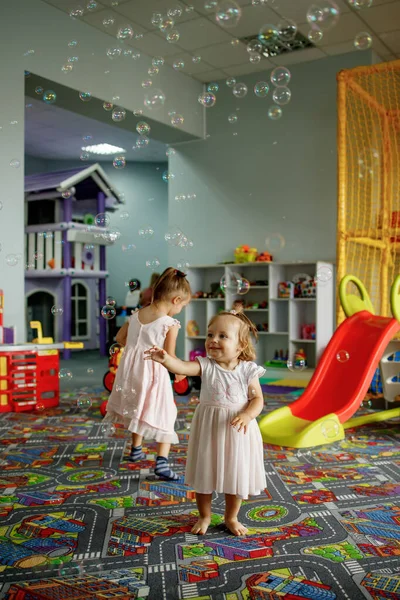 Two Little Sisters Playing Soap Bubbles Dancing Celebrating Birthday Being — Foto de Stock