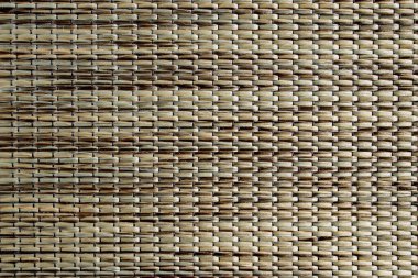 Textile pastel background with abstract weaving of threads. Fabric tufted multi-colored background.