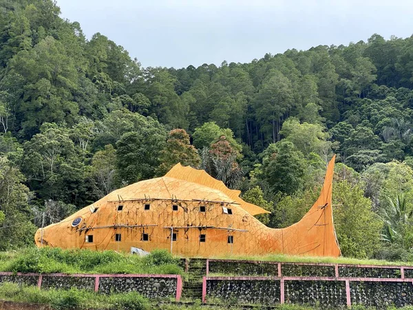 Old fish wooden house monument in the mountains
