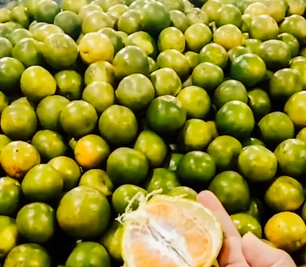 Pile of fresh sweet ripe green oranges