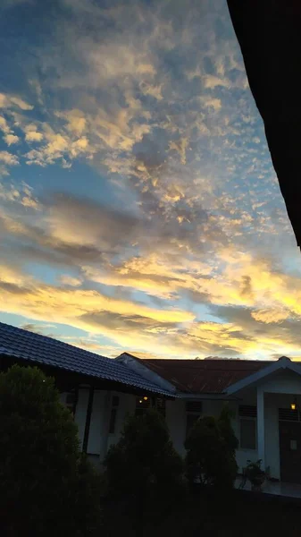 Sky with golden clouds in the setting sun in the afternoon