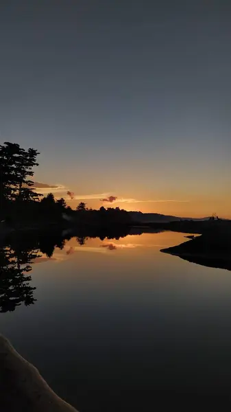 The sunset behind the mountain becomes a beautiful sunset view