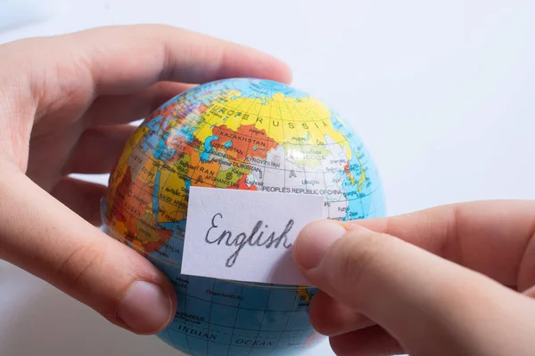 Hand Holding Notepaper Russian Wording Model Globe — стоковое фото