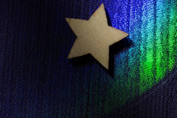 Ξύλινο Αστέρι Σχήμα Πολύχρωμο Φόντο Ύφασμα — Φωτογραφία Αρχείου