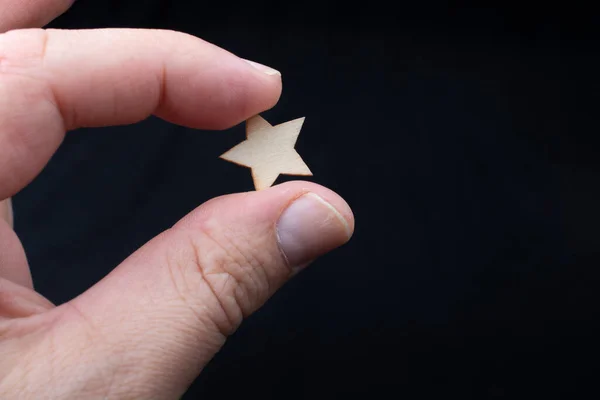 Hand Holding Wooden Star — Stock Photo, Image