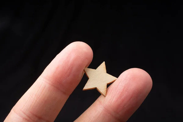 Hand Holding Wooden Star — Stock Photo, Image
