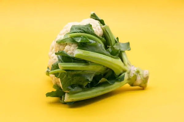 Cauliflower Leaves Isolated Yellow Background — Stock Photo, Image