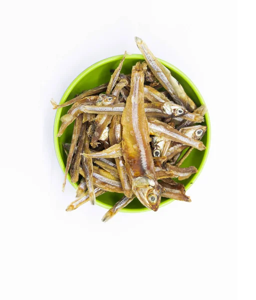 Dried Small fish or Salted anchovy fishes isolate on white background, Tiny Fish as food ingredient,