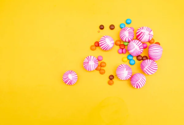 Small Big Candies Pieces Isolated Yellow Background —  Fotos de Stock
