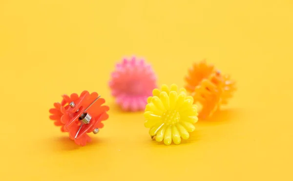 Cute kids hair claws on yellow background.