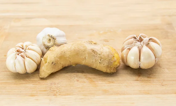 fresh ginger and garlic on wooden background, Ginger root