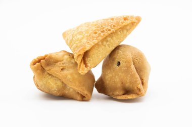 three pieces golden samosa and singara isolated on white background