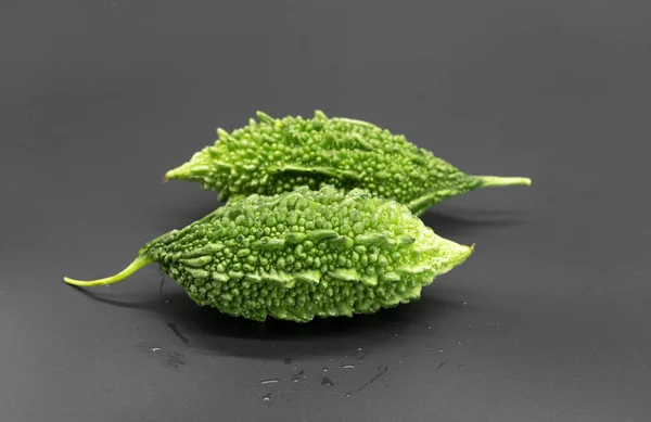 Two Bitter Melon Bitter Gourd Drop Water Isolated Black Background — Foto de Stock