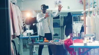 African tailor is using a VR-device at work