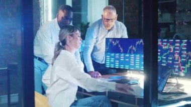 A team of stockbrokers and monitoring stock data. Financial, investment, business concept.