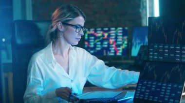 A woman is analyzing the stock market information. Businessman trader, broker concept.