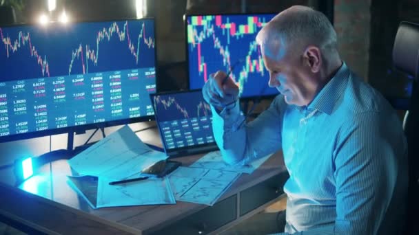 A stockbroker is getting tired while analyzing stock rates — Stock Video