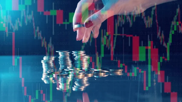 Multilayered display with stock charts and a pile of coins