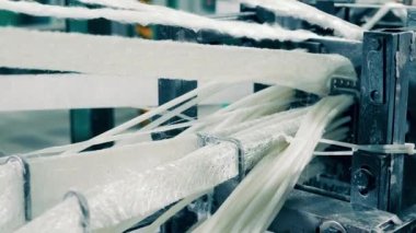 Fiberglass is getting manufactured by an industrial machine