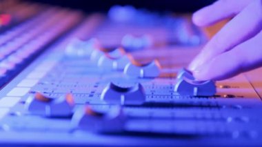 Close up of a mixing console getting regulated. 4K
