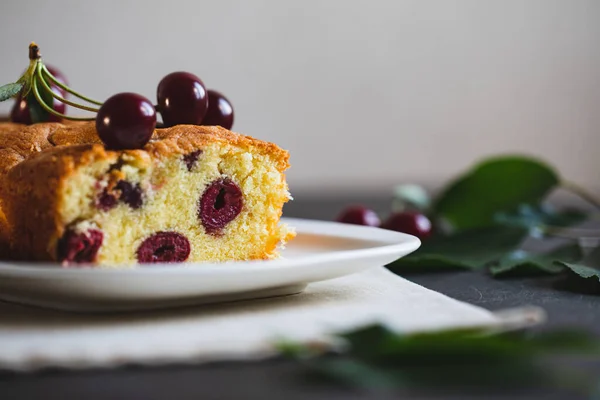 delicious sweet cake with cherries and a fresh cherry on the side. cherry pie.