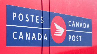 Truro, Canada - February 09, 2020: Canada Post delivery truck detail. Canada Post Corporation is Canada's main postal service provider and is a crown corporation.
