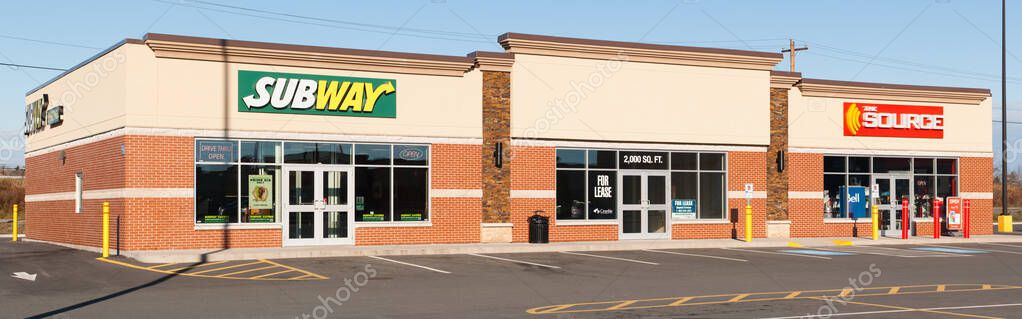 ELMSDALE, CANADA - NOVEMBER 16, 2015: Subway is an American fast food franchise offering sub sandwiches and salads. The Source is a retailer which specializes in electronics.