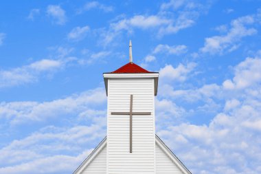 Christian church steeple and blue sky with copy space