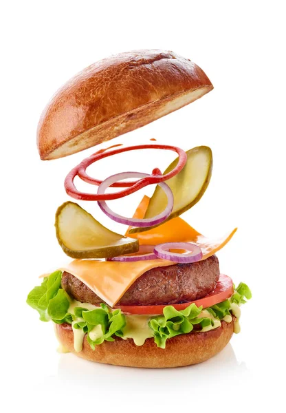Burger Dengan Bahan Terbang Terisolasi Pada Latar Belakang Putih Stok Gambar Bebas Royalti