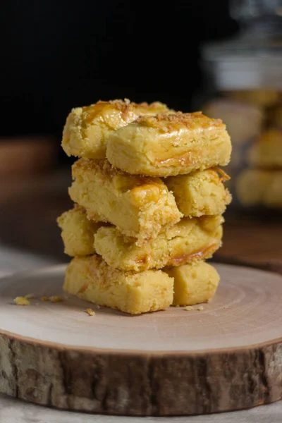 homemade cookies with sesame seeds and cheese on a wooden board