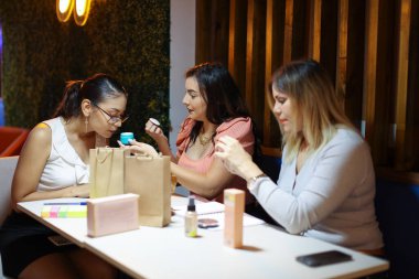 Entrepeneur Women Packing Products of Business Smiling and Smelling . High quality photo