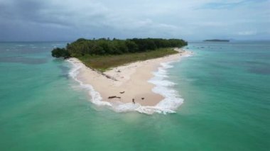 Drone view of couple in Caribbean island in the summer visiting Bocas del Toro Panama. High quality FullHD footage