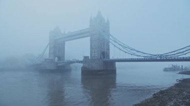 Tower Bridge and River Thames in foggy and misty atmospheric and moody weather conditions in London City Centre on Coronavirus Covid-19 lockdown day one, England, UK