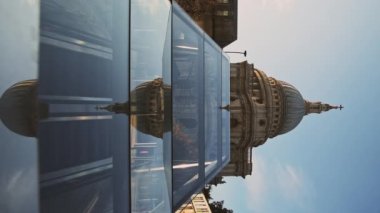 Vertical video of St Pauls Cathedral, a popular London tourist attraction and beautiful famous building on a bright blue sky day, shot in the Coronavirus Covid-19 pandemic Lockdown in England, Europe